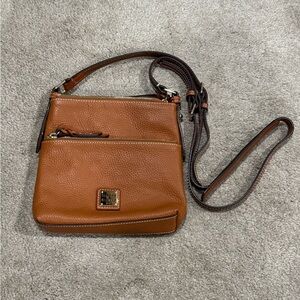 Dooney and Burke pebble grain leather crossbody. Saddle colored.